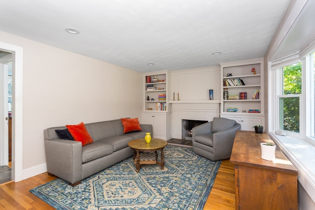 8 May Street Sharon, MA 02067 - Photo 6 of 39 a living room with furniture fireplace and window