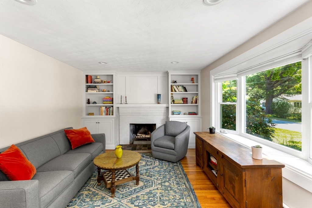 8 May Street Sharon, MA 02067 - Photo 7 of 39 a living room with furniture fireplace and a large window