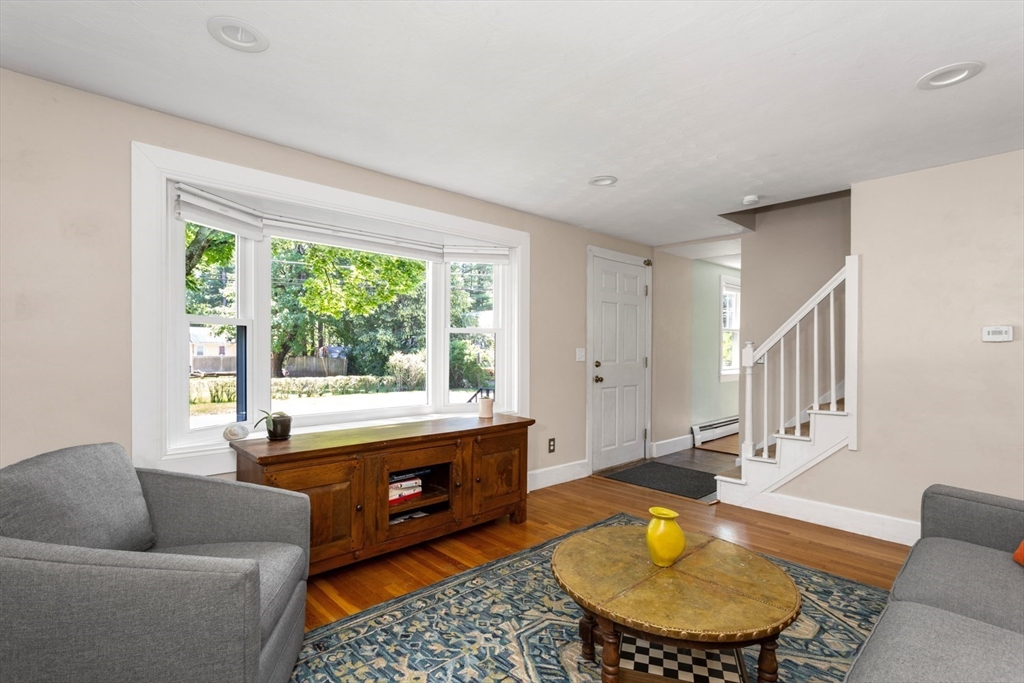 8 May Street Sharon, MA 02067 - Photo 8 of 39 a living room with furniture and a large window