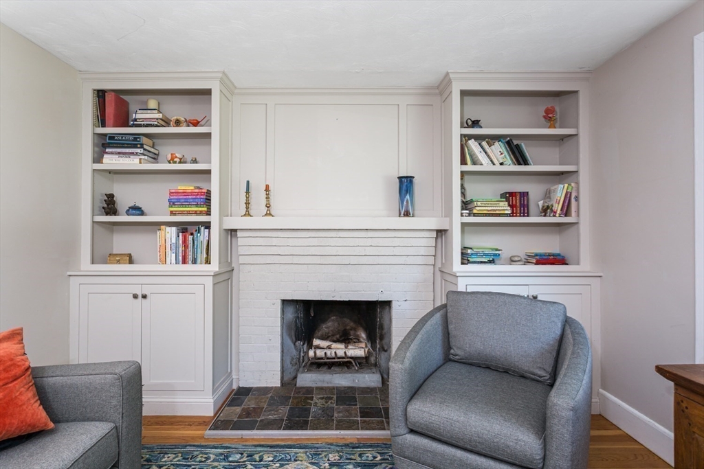 8 May Street Sharon, MA 02067 - Photo 9 of 39 a living room with furniture and a fireplace
