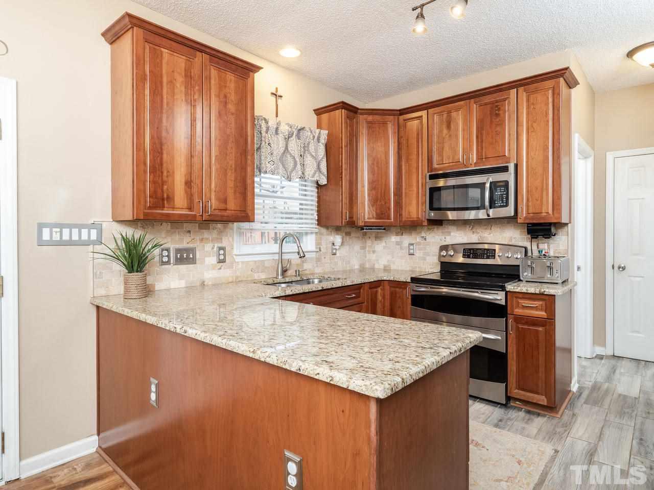 8604 Harps Mill Road Raleigh, NC 27615 - Photo 4 of 26