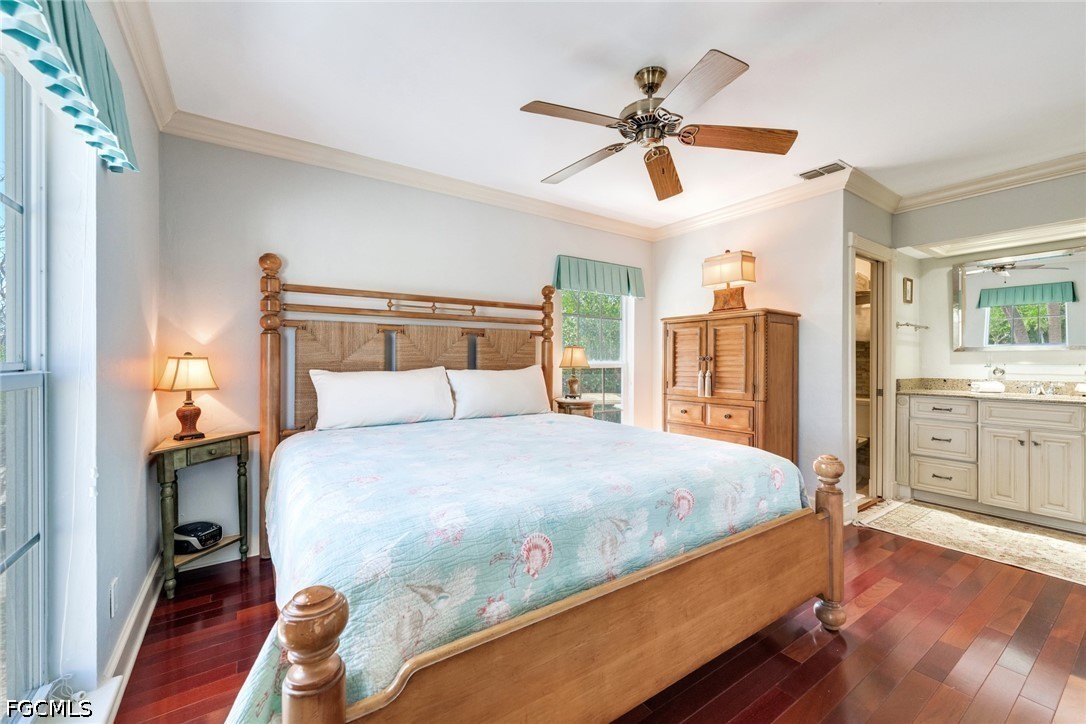 303 Useppa Useppa Island, Unit A Bokeelia, FL 33922 - Photo 16 of 50 a bedroom with a large bed and a chandelier