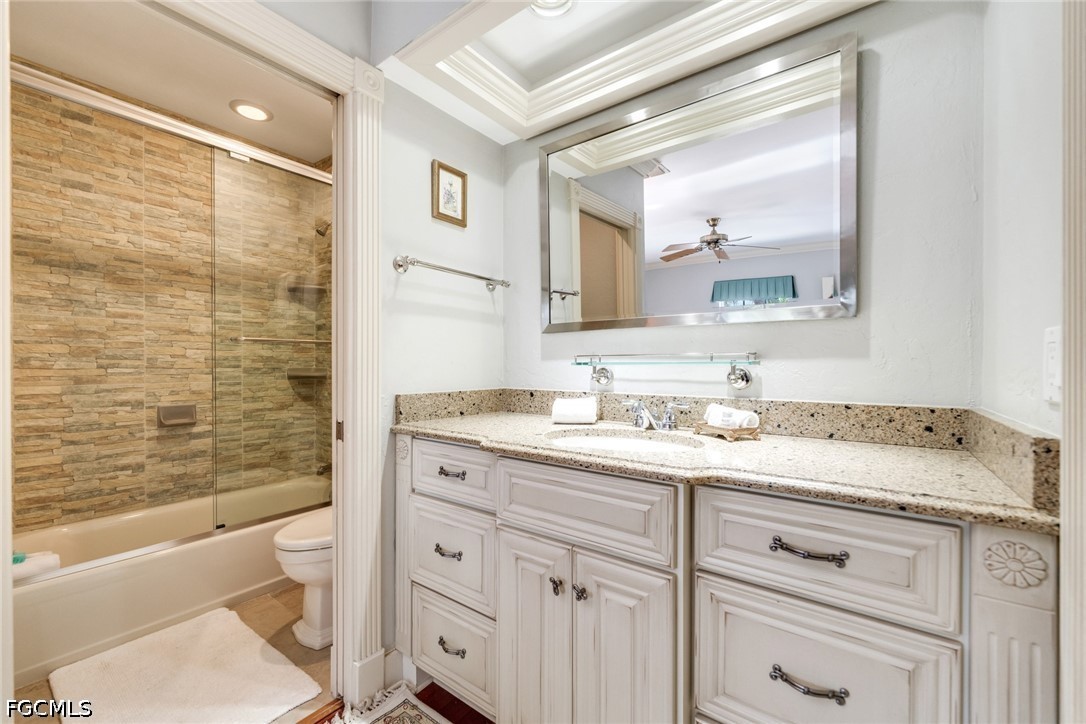 303 Useppa Useppa Island, Unit A Bokeelia, FL 33922 - Photo 18 of 50 a bathroom with a granite countertop sink toilet and shower