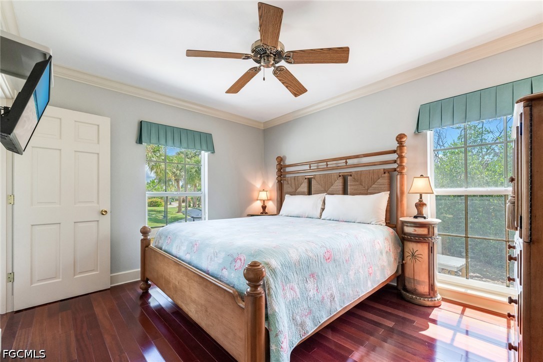 303 Useppa Useppa Island, Unit A Bokeelia, FL 33922 - Photo 20 of 50 a bedroom with a bed and window
