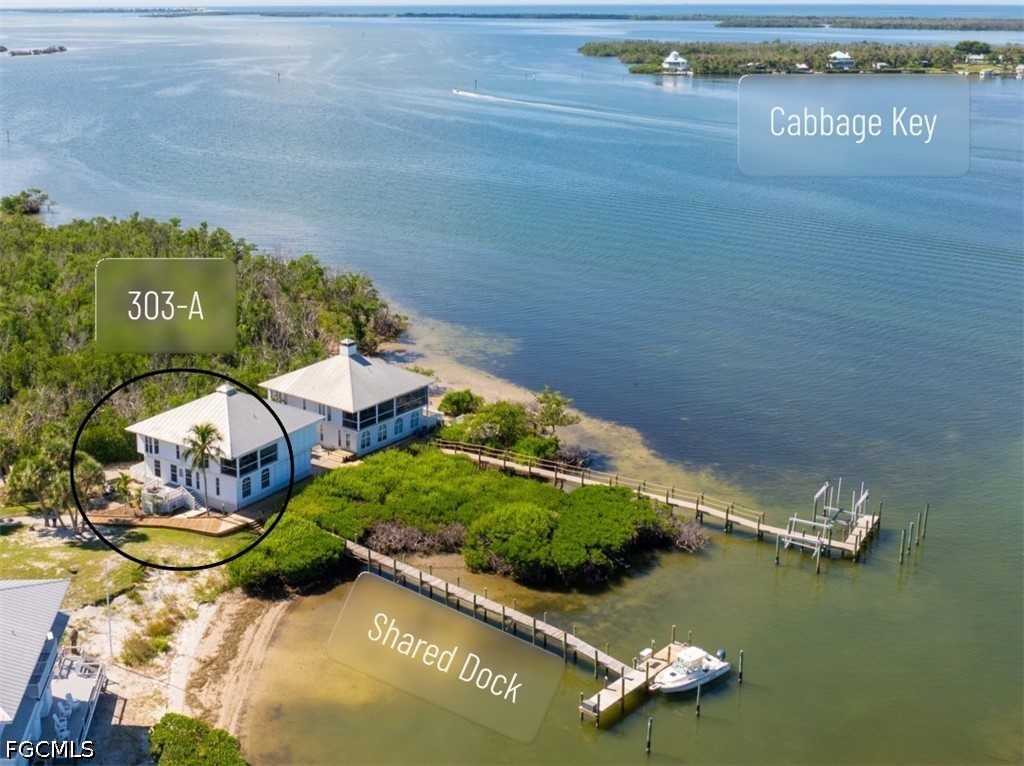 303 Useppa Useppa Island, Unit A Bokeelia, FL 33922 - Photo 2 of 50 an aerial view of a house with a lake view