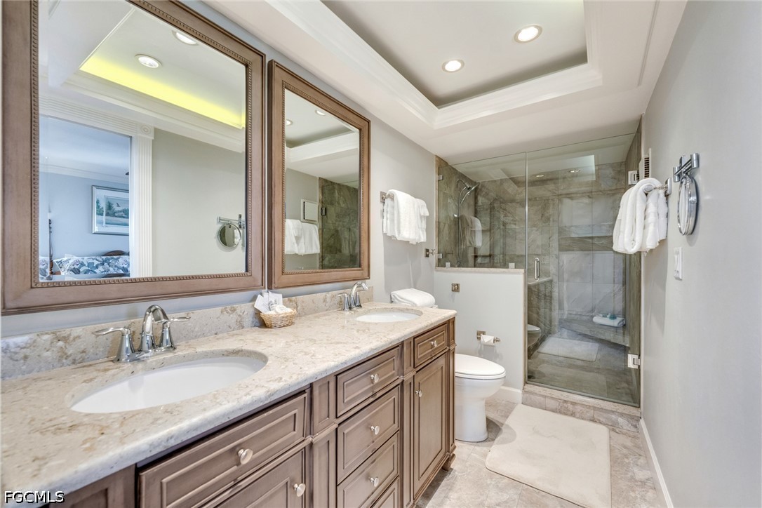 303 Useppa Useppa Island, Unit A Bokeelia, FL 33922 - Photo 26 of 50 a bathroom with a granite countertop sink mirror vanity and toilet