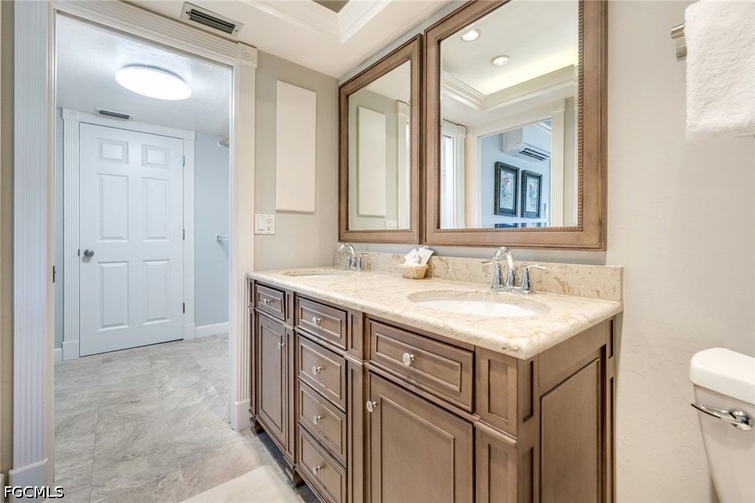 303 Useppa Useppa Island, Unit A Bokeelia, FL 33922 - Photo 27 of 50 a bathroom with a sink and a mirror