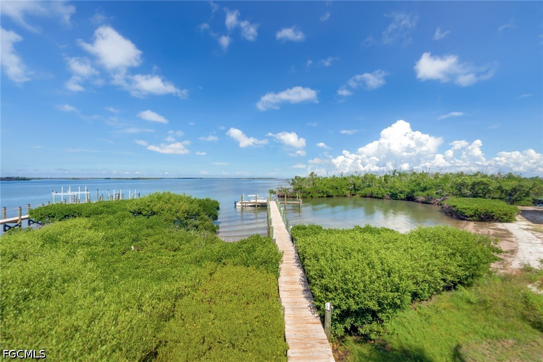 303 Useppa Useppa Island, Unit A Bokeelia, FL 33922 - Photo 35 of 50 a view of a lake in front of the house