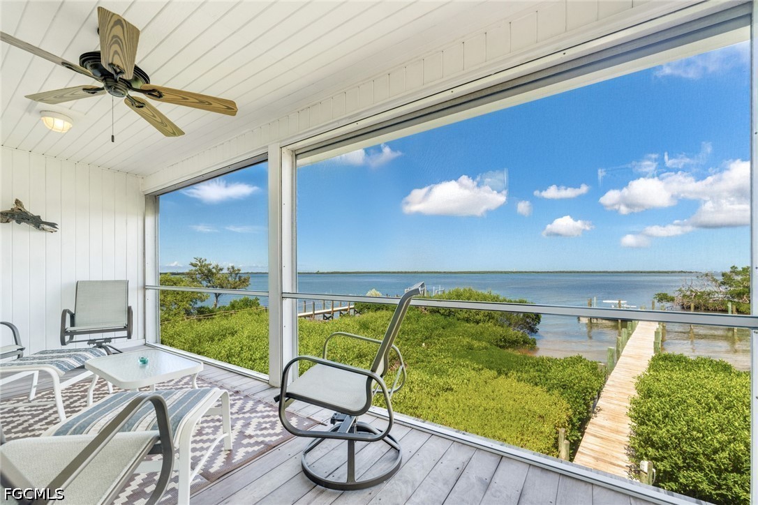 303 Useppa Useppa Island, Unit A Bokeelia, FL 33922 - Photo 36 of 50 a living room with furniture and a large window