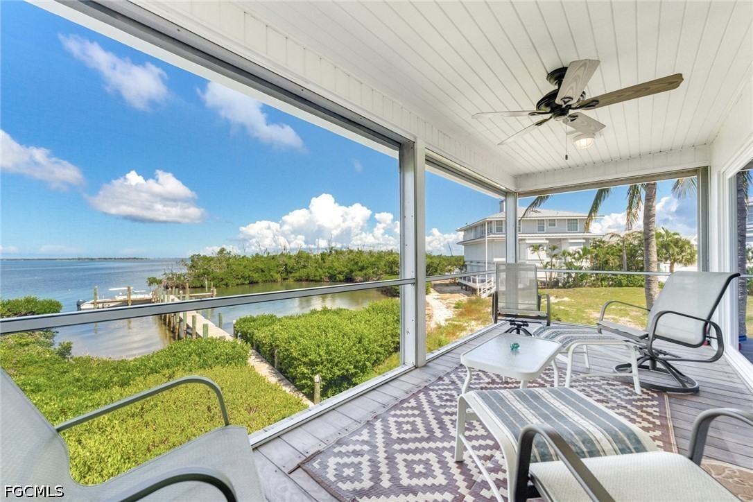 303 Useppa Useppa Island, Unit A Bokeelia, FL 33922 - Photo 37 of 50 a view of a swimming pool and outdoor seating