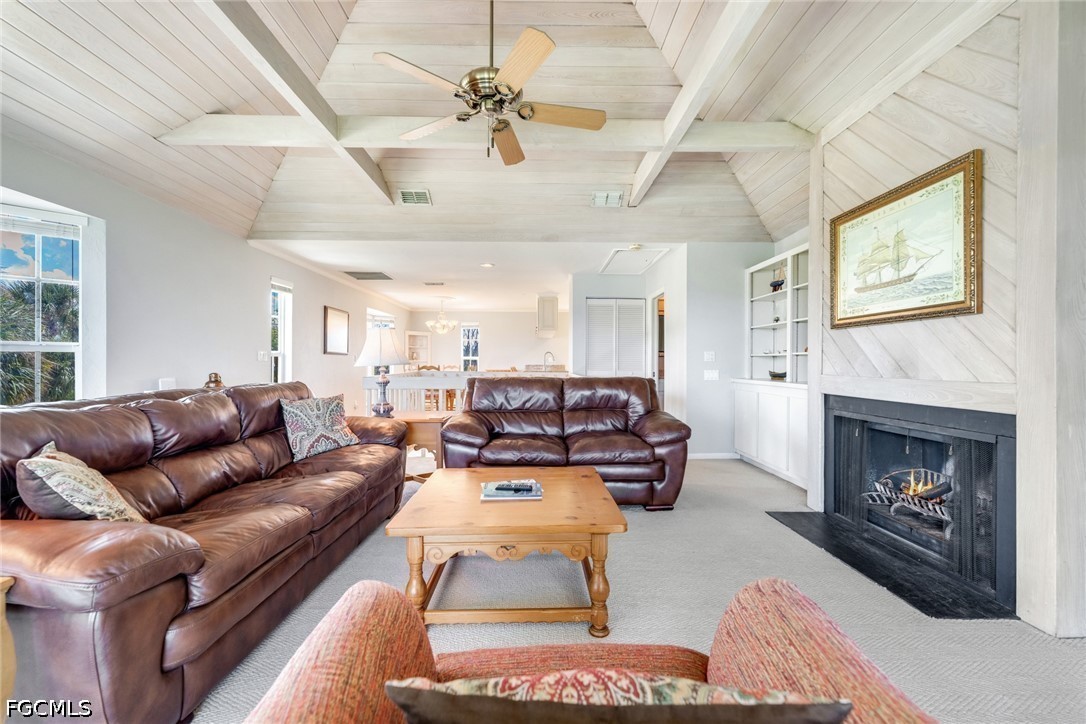 303 Useppa Useppa Island, Unit A Bokeelia, FL 33922 - Photo 39 of 50 a living room with furniture or fireplace and a wooden floor