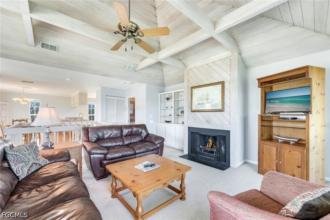 303 Useppa Useppa Island, Unit A Bokeelia, FL 33922 - Photo 40 of 50 a living room with furniture and a fireplace