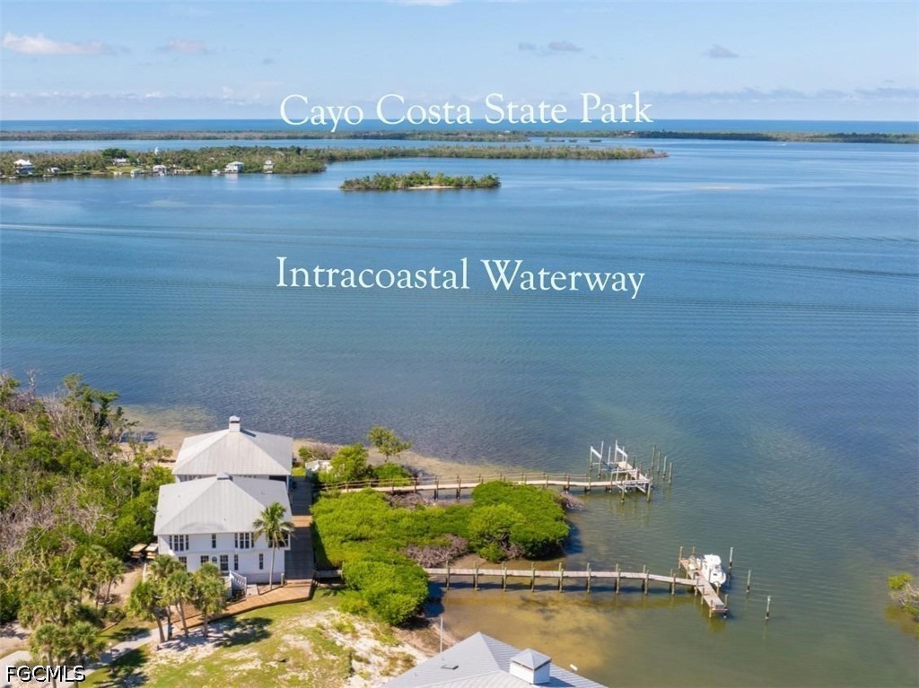 303 Useppa Useppa Island, Unit A Bokeelia, FL 33922 - Photo 4 of 50 an aerial view of a house with a lake view