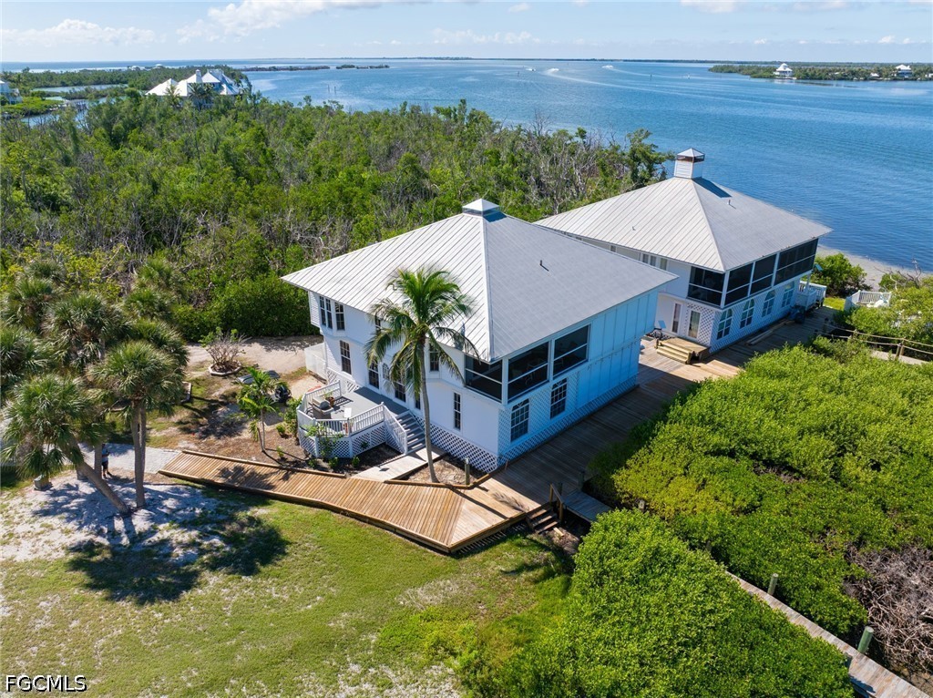 303 Useppa Useppa Island, Unit A Bokeelia, FL 33922 - Photo 49 of 50 an aerial view of a house having yard swimming pool and a yard