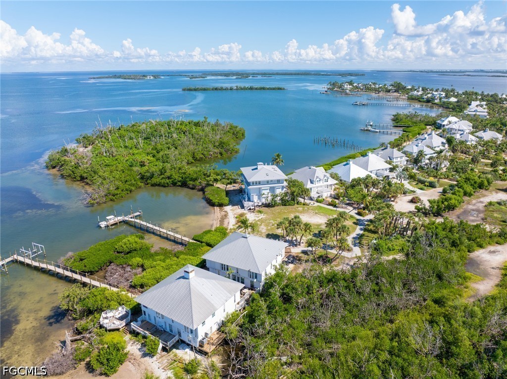303 Useppa Useppa Island, Unit A Bokeelia, FL 33922 - Photo 8 of 50 an aerial view of a house with a lake view