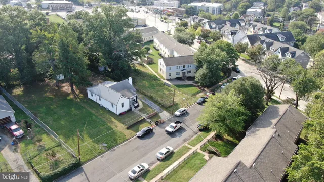 an aerial view of multiple houses with yard