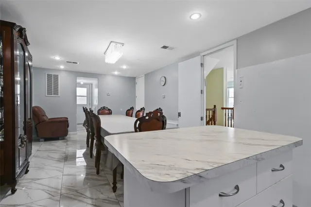 a view of a kitchen and dining room