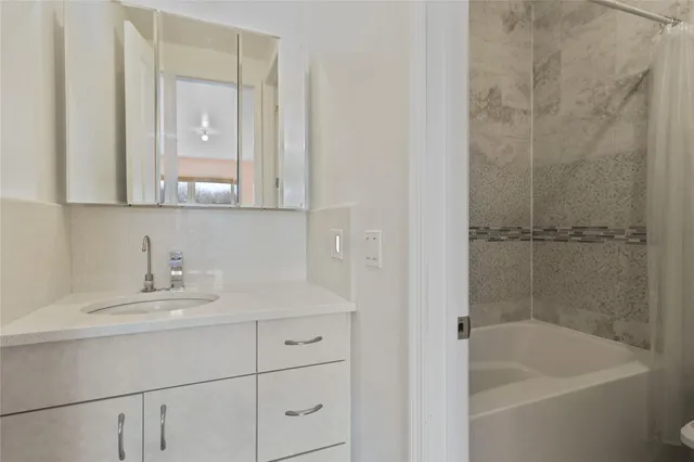 a bathroom with a sink and a bathtub