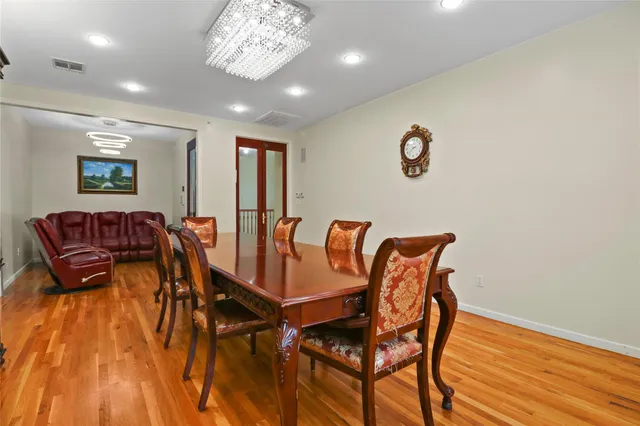 a view of a room with furniture and wooden floor