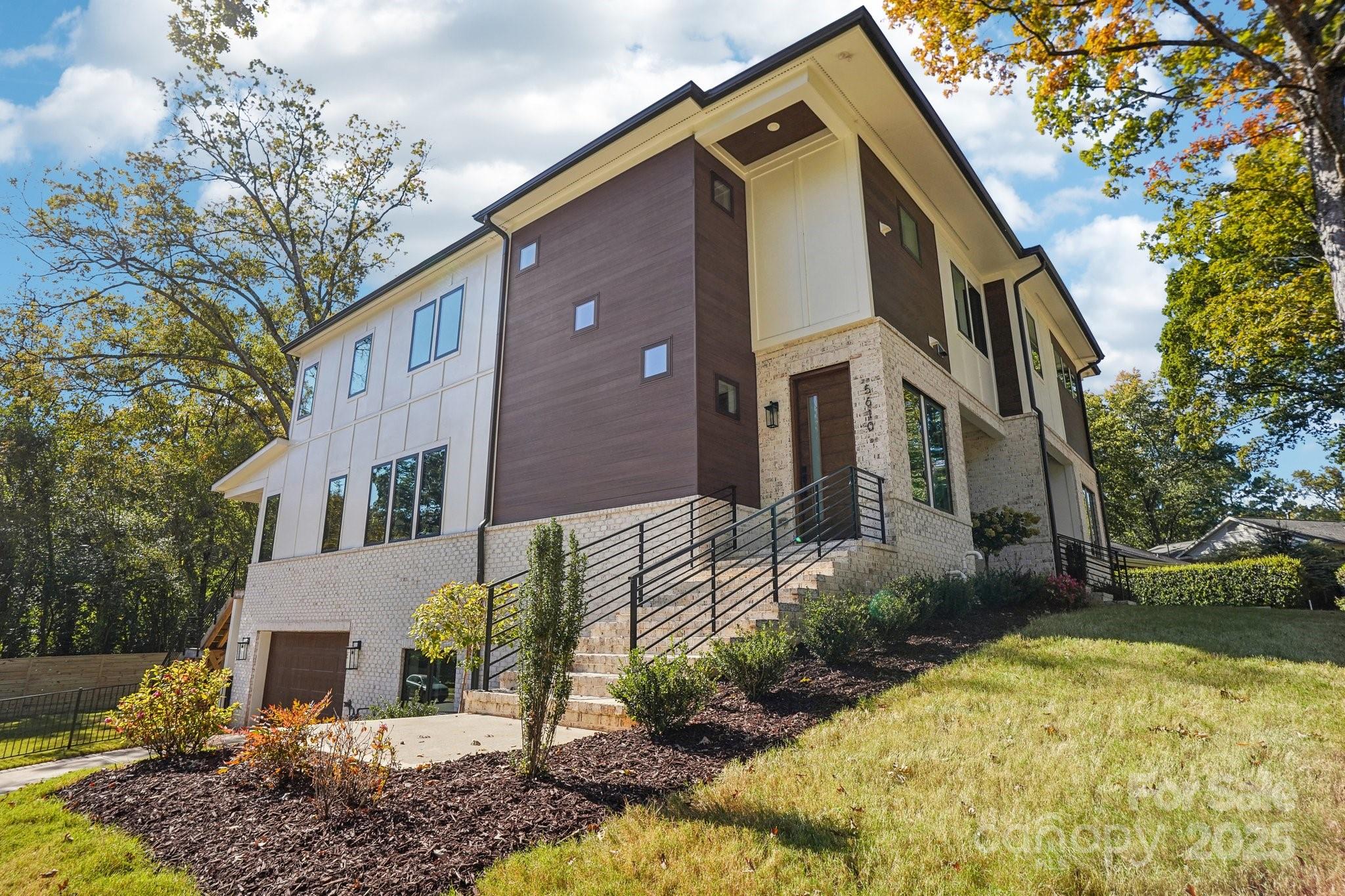 5610 Farmbrook Drive Charlotte, NC 28210 - Photo 1 of 45 a front view of a house with a yard