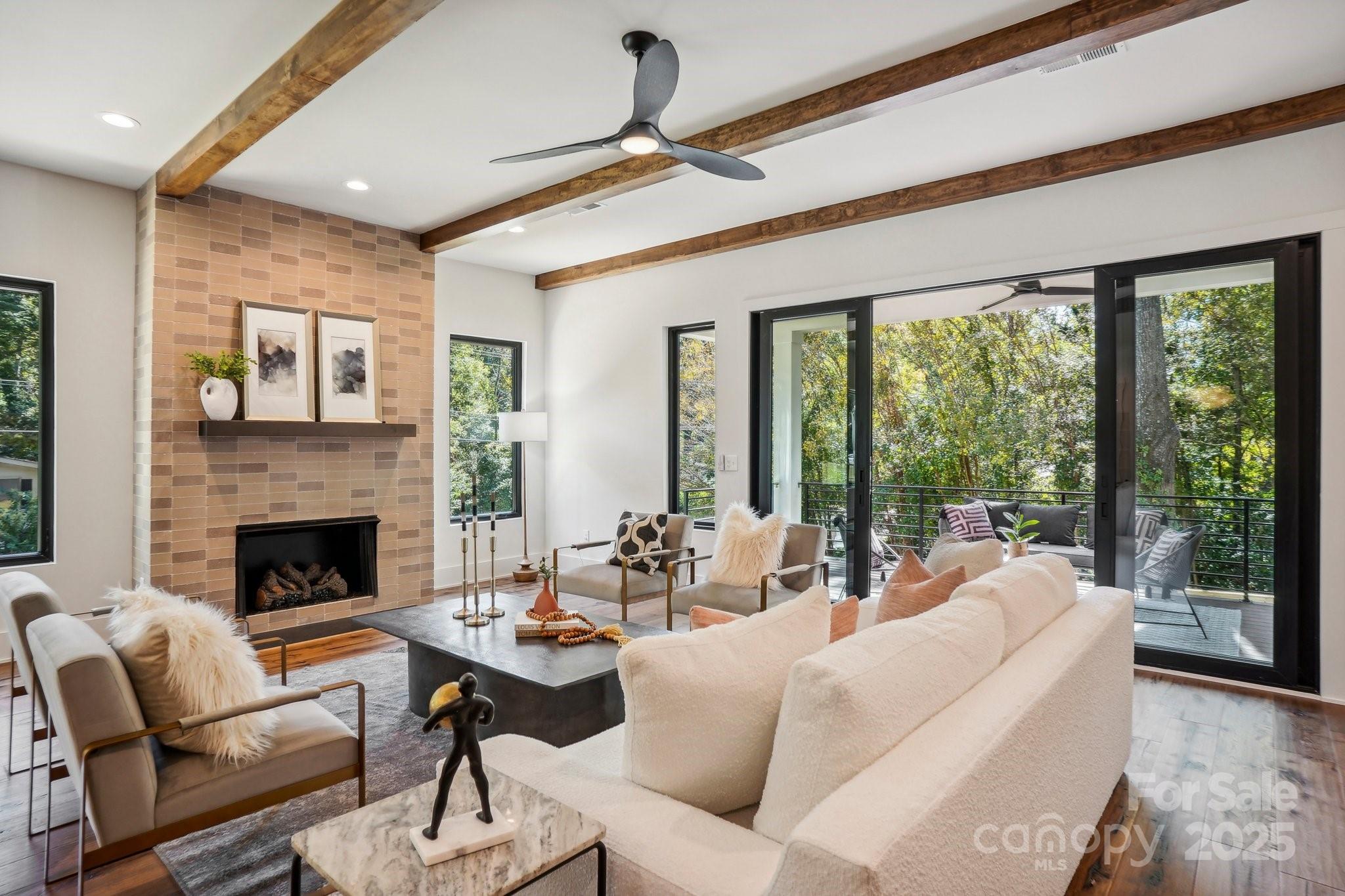 5610 Farmbrook Drive Charlotte, NC 28210 - Photo 13 of 45 a living room with furniture and a fireplace