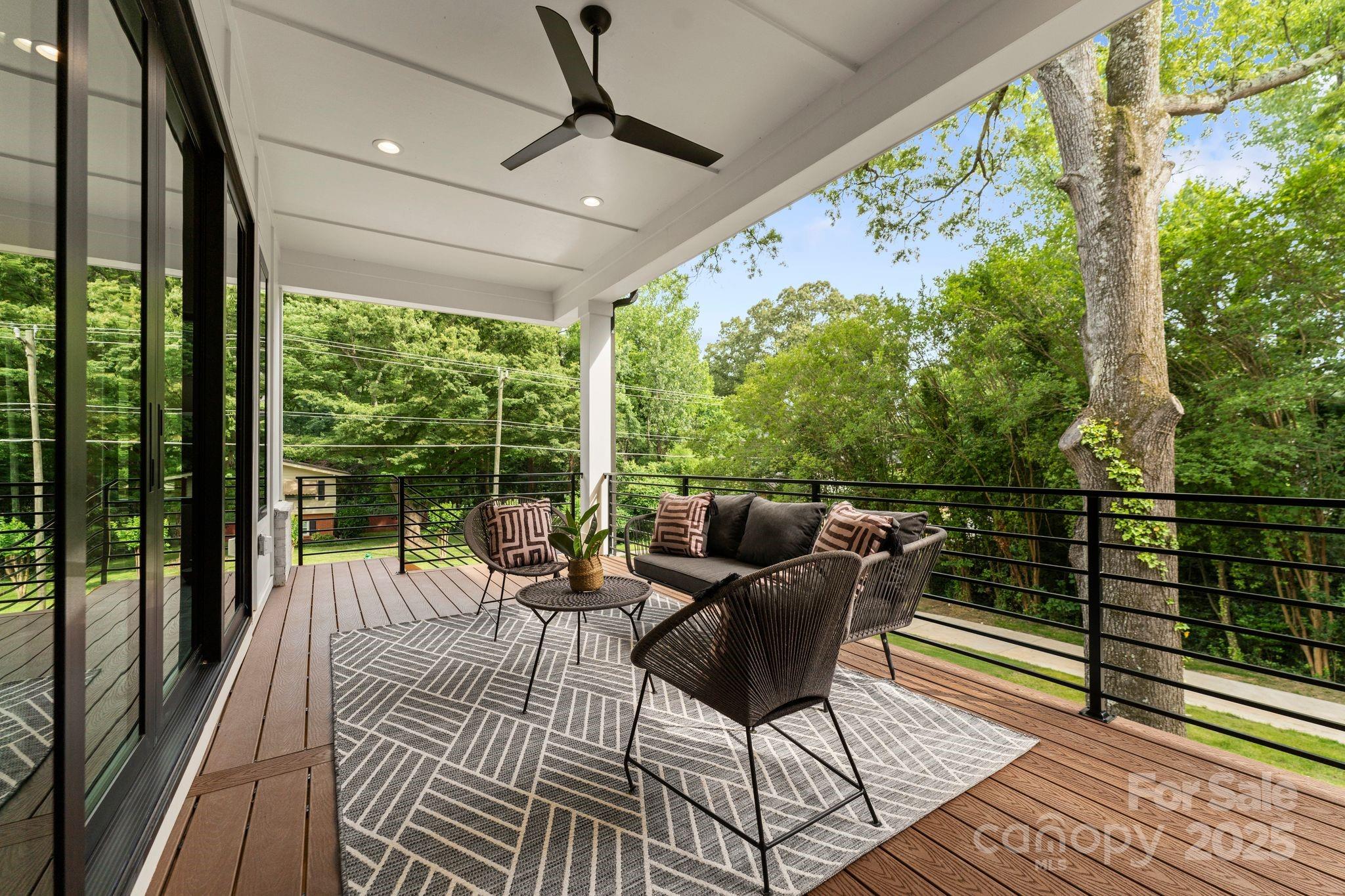 5610 Farmbrook Drive Charlotte, NC 28210 - Photo 14 of 45 a balcony with wooden floor and outdoor seating