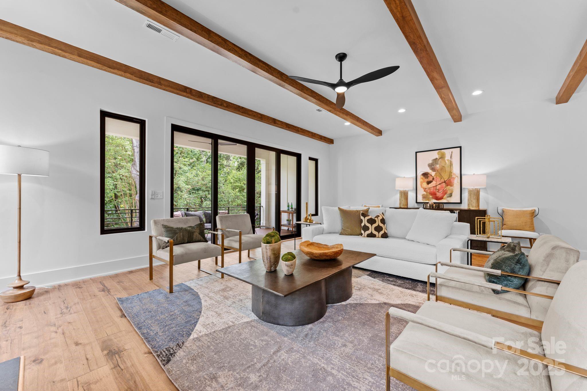5610 Farmbrook Drive Charlotte, NC 28210 - Photo 15 of 45 a living room with furniture and a large window