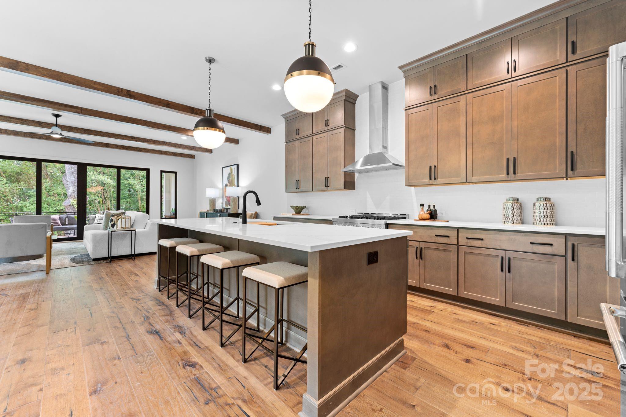 5610 Farmbrook Drive Charlotte, NC 28210 - Photo 16 of 45 a large kitchen with kitchen island a large island in it