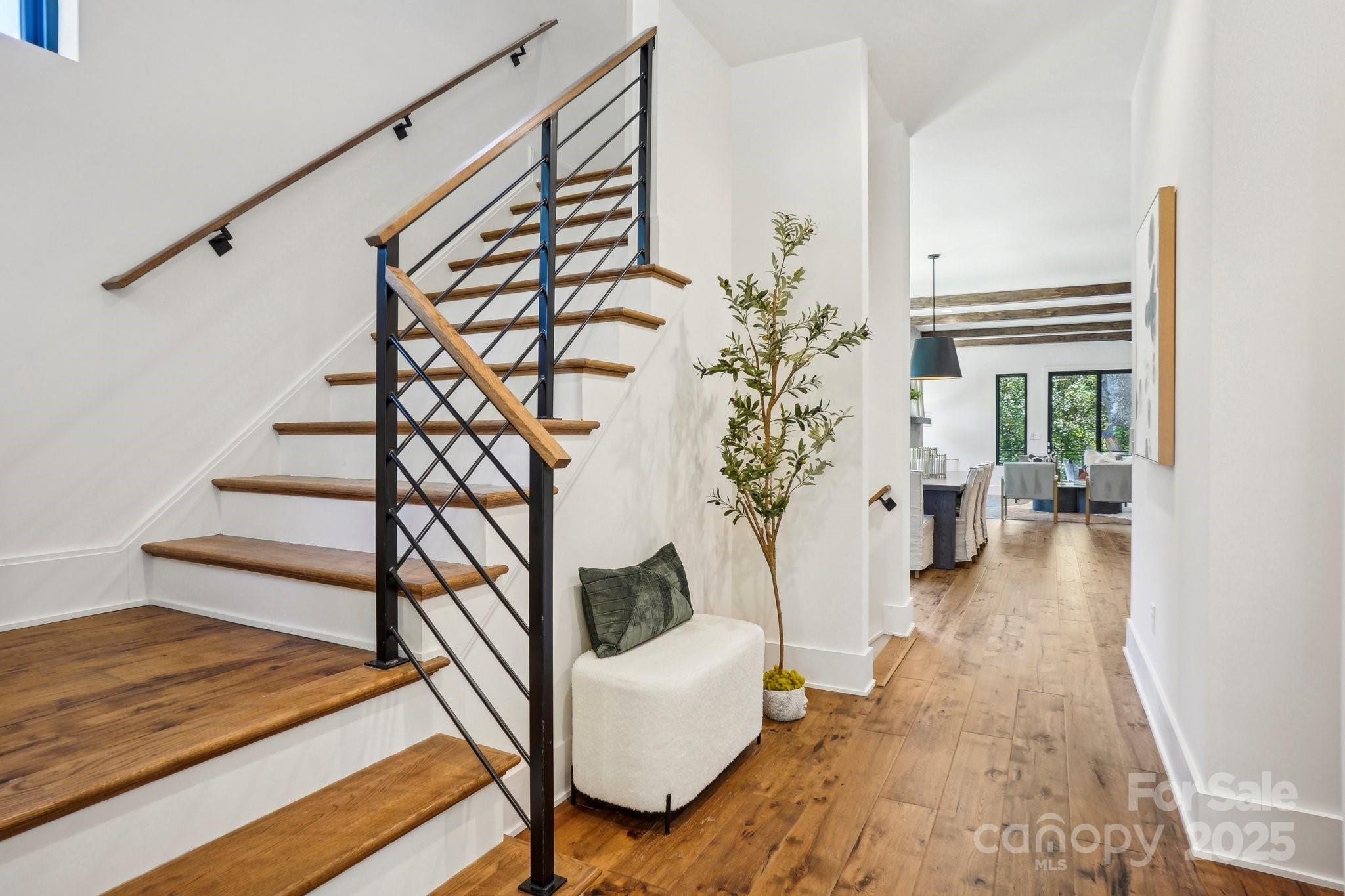 5610 Farmbrook Drive Charlotte, NC 28210 - Photo 2 of 45 a view of entryway with wooden floor and stairs