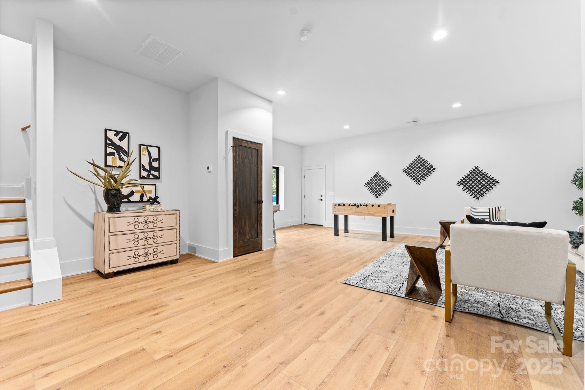 5610 Farmbrook Drive Charlotte, NC 28210 - Photo 34 of 45 a living room with furniture and wooden floor