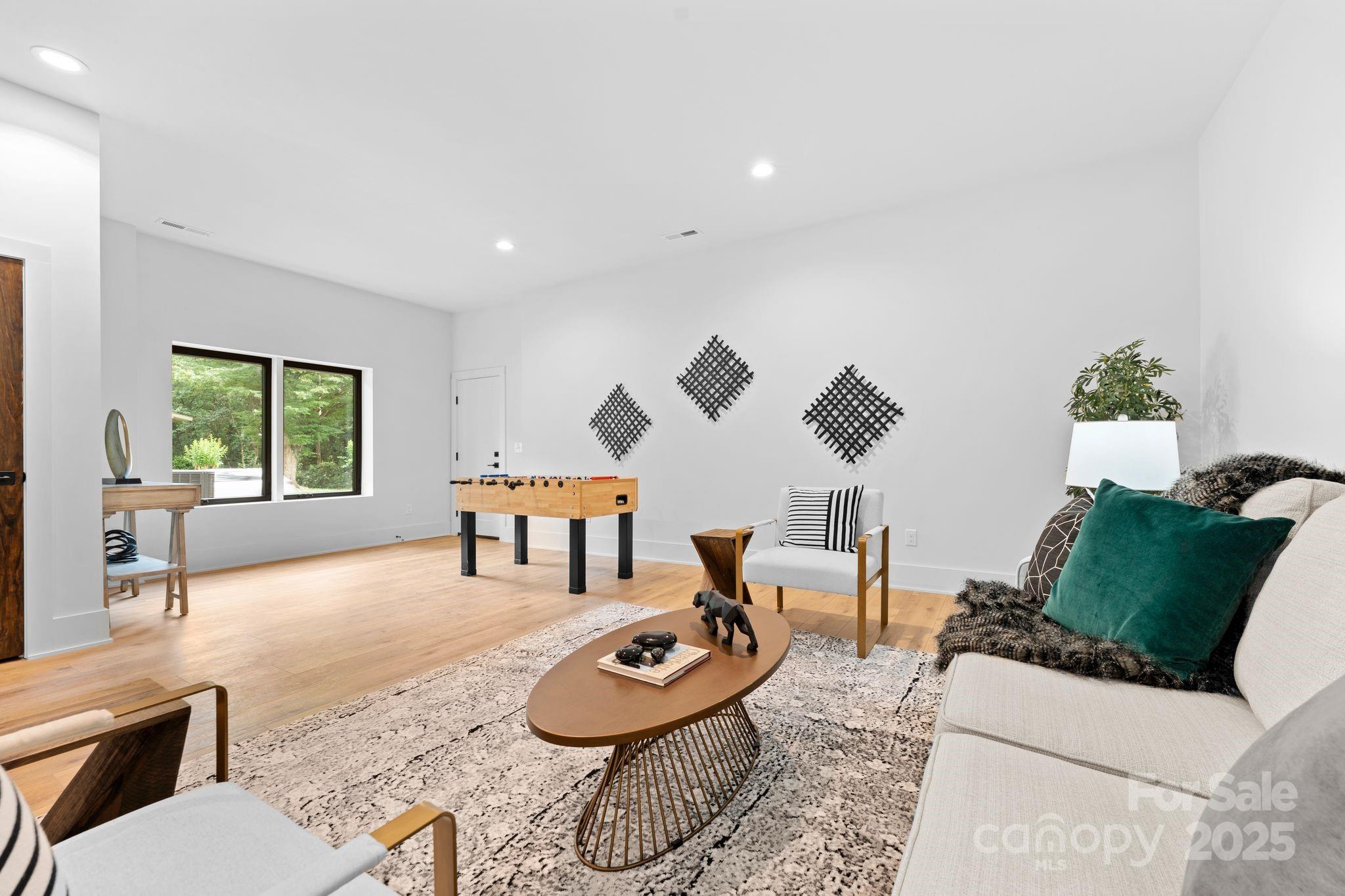 5610 Farmbrook Drive Charlotte, NC 28210 - Photo 36 of 45 a living room with furniture and a large window