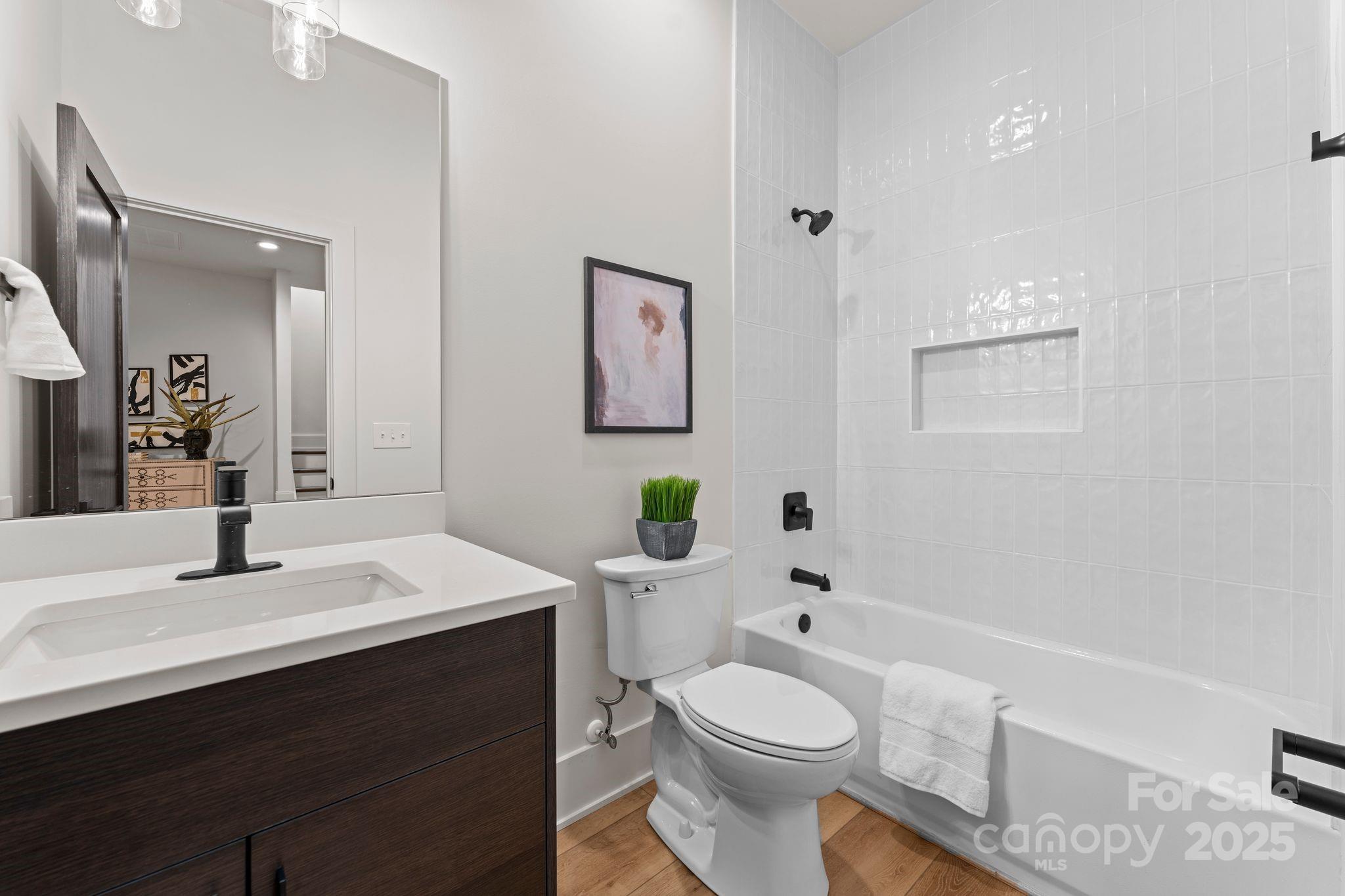 5610 Farmbrook Drive Charlotte, NC 28210 - Photo 39 of 45 a bathroom with a sink a toilet and shower