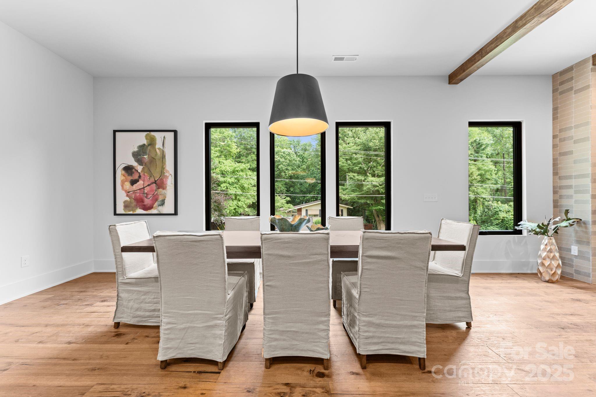 5610 Farmbrook Drive Charlotte, NC 28210 - Photo 10 of 45 a view of a dining room with furniture window and wooden floor