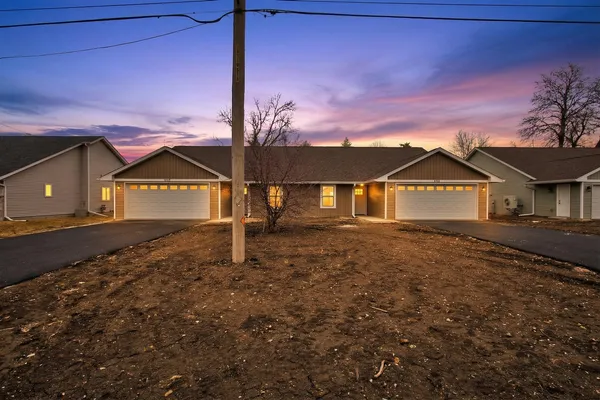 a view of house with a yard
