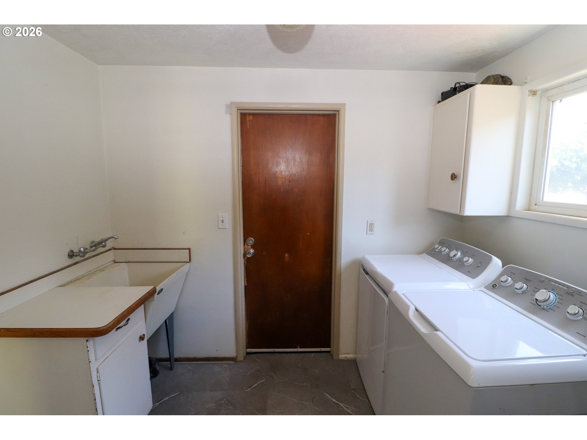 7077 Main Street Springfield, OR 97478 - Photo 27 of 34 a room with a sink cabinets and utility room