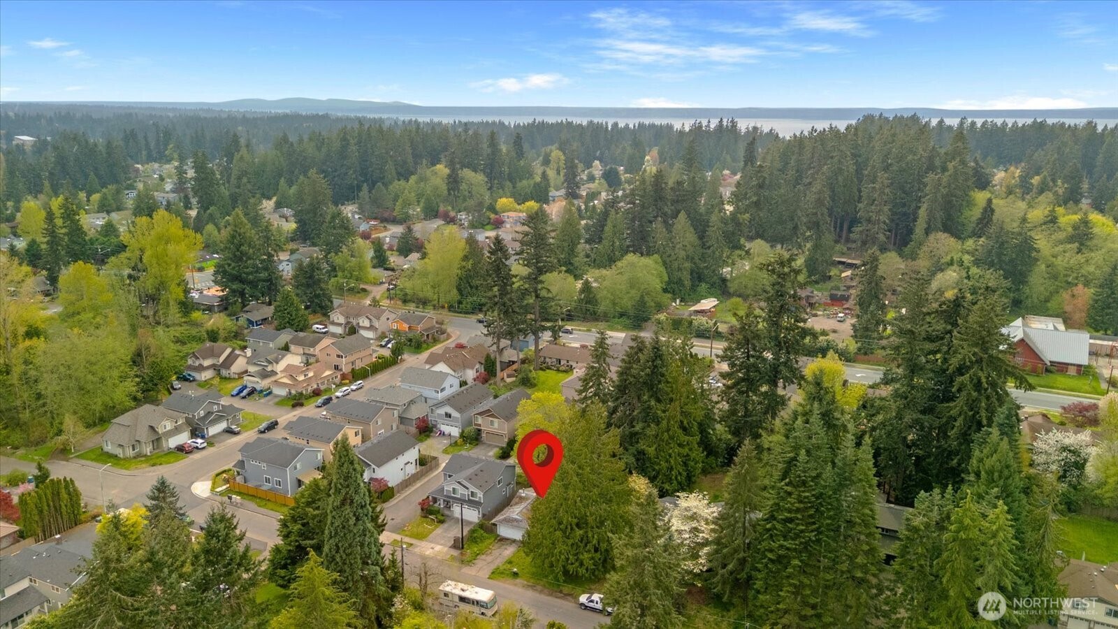 15316 50th Place West Edmonds, WA 98026 - Photo 12 of 12 an aerial view of residential houses with outdoor space and trees