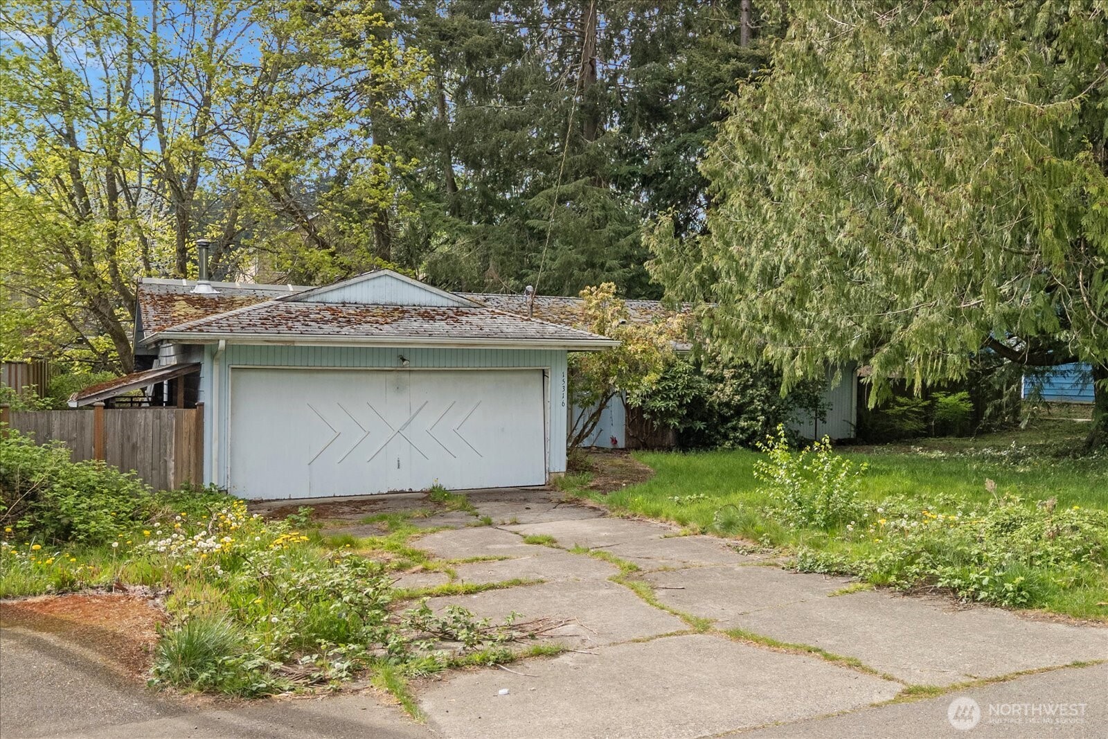 15316 50th Place West Edmonds, WA 98026 - Photo 2 of 12 a front view of a house with a garden