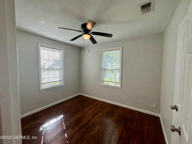 a view of empty room with windows