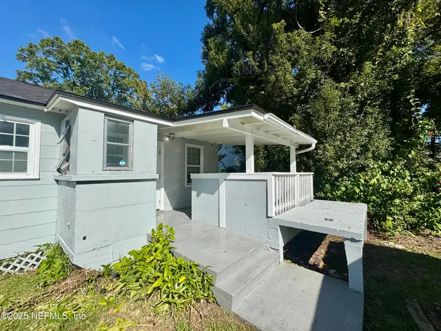 a view of house with yard outdoor seating and green space