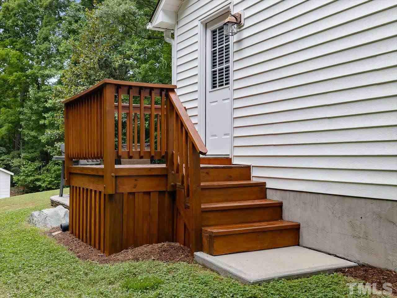 6441 Guess Road Durham, NC 27712 - Photo 12 of 30 a view of a house with a yard and stairs