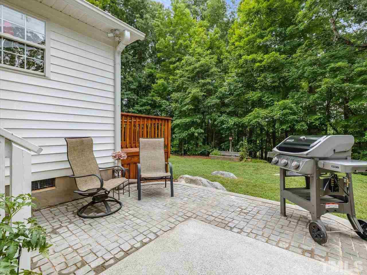 6441 Guess Road Durham, NC 27712 - Photo 15 of 30 a view of a patio with table and chairs and potted plants