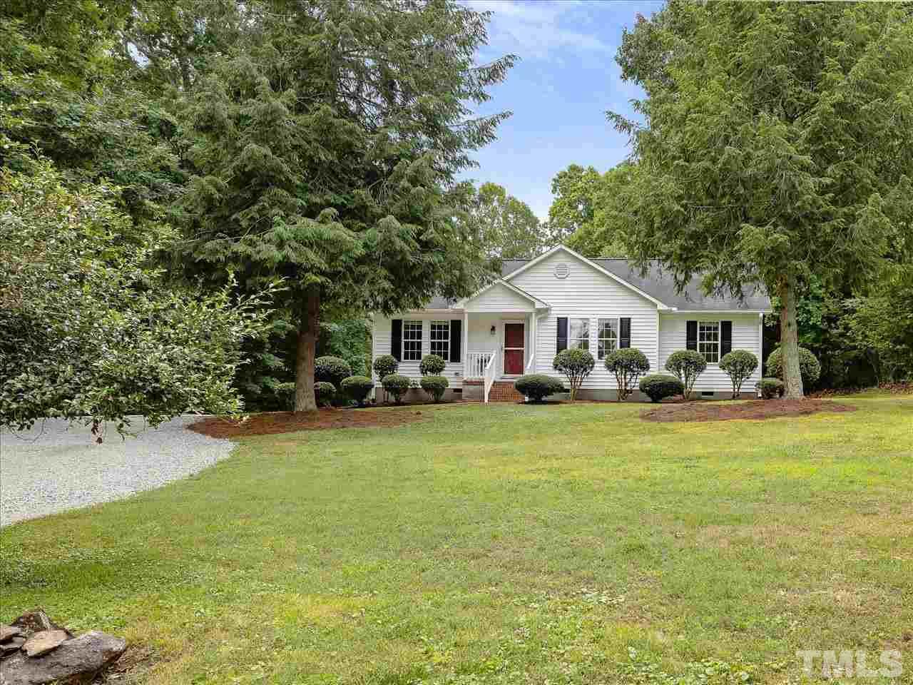 6441 Guess Road Durham, NC 27712 - Photo 4 of 30 a front view of a house with yard and green space