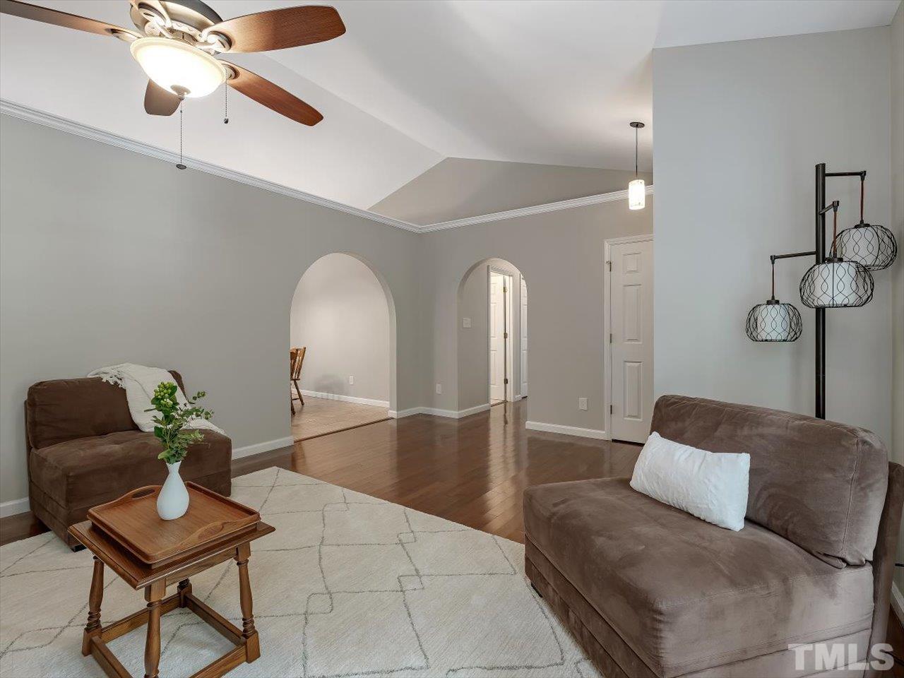 6441 Guess Road Durham, NC 27712 - Photo 9 of 30 a living room with furniture and a chandelier