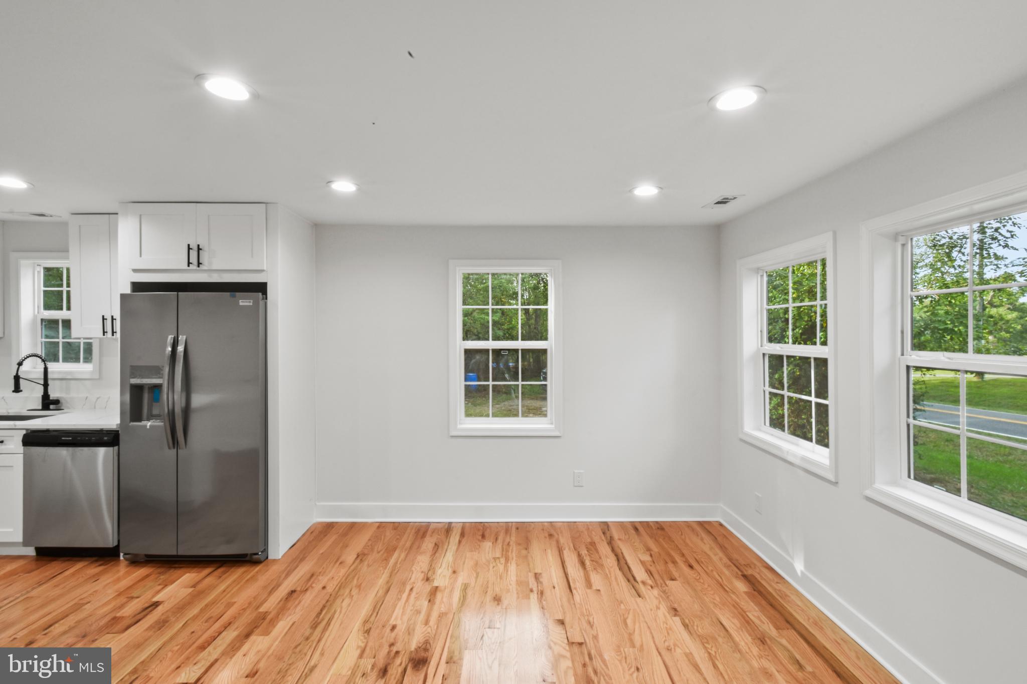18084 Monrovia Road Orange, VA 22960 - Photo 11 of 28 a view of a kitchen with a refrigerator cabinets and wooden floor
