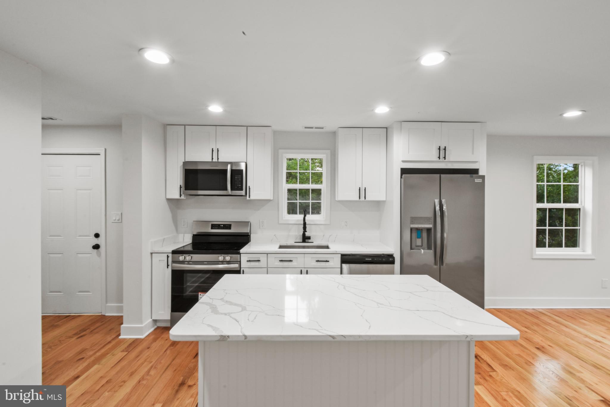 18084 Monrovia Road Orange, VA 22960 - Photo 14 of 28 a large kitchen with kitchen island a sink stainless steel appliances and cabinets