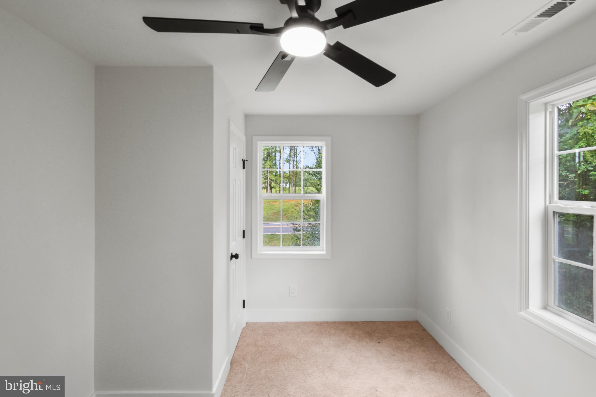 18084 Monrovia Road Orange, VA 22960 - Photo 17 of 28 an empty room with windows and fan