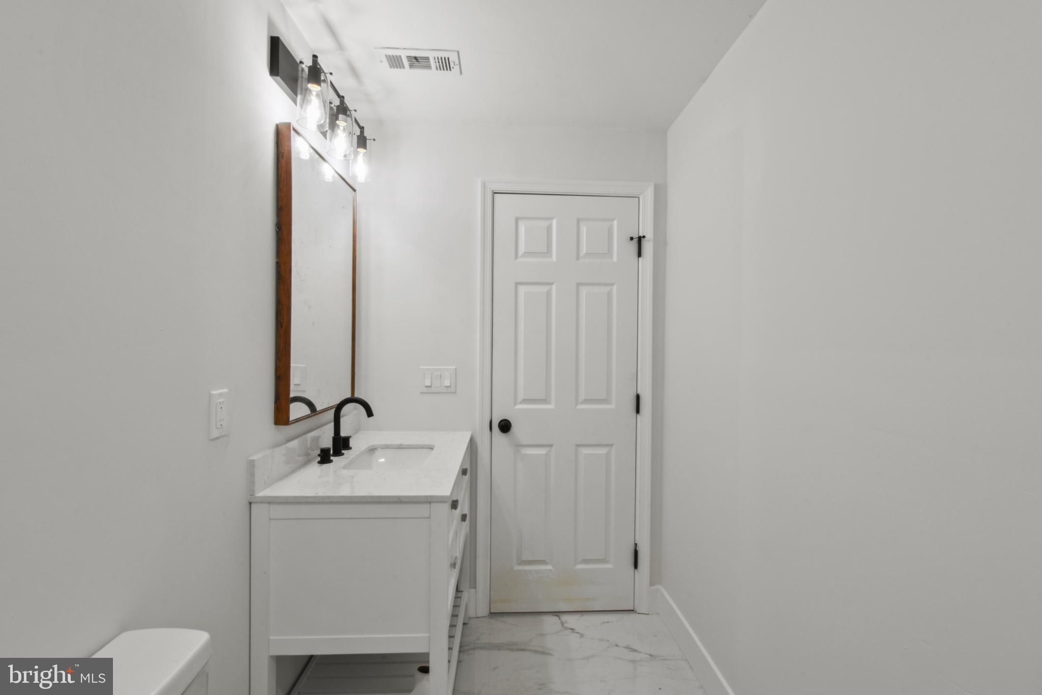 18084 Monrovia Road Orange, VA 22960 - Photo 24 of 28 a bathroom with a sink a toilet and shower