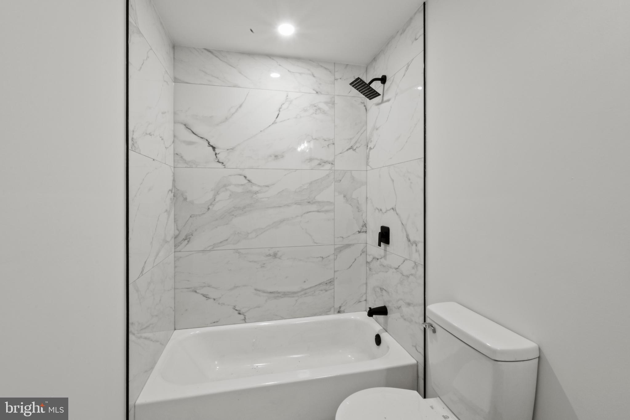 18084 Monrovia Road Orange, VA 22960 - Photo 25 of 28 a bathroom with a bathtub and a toilet