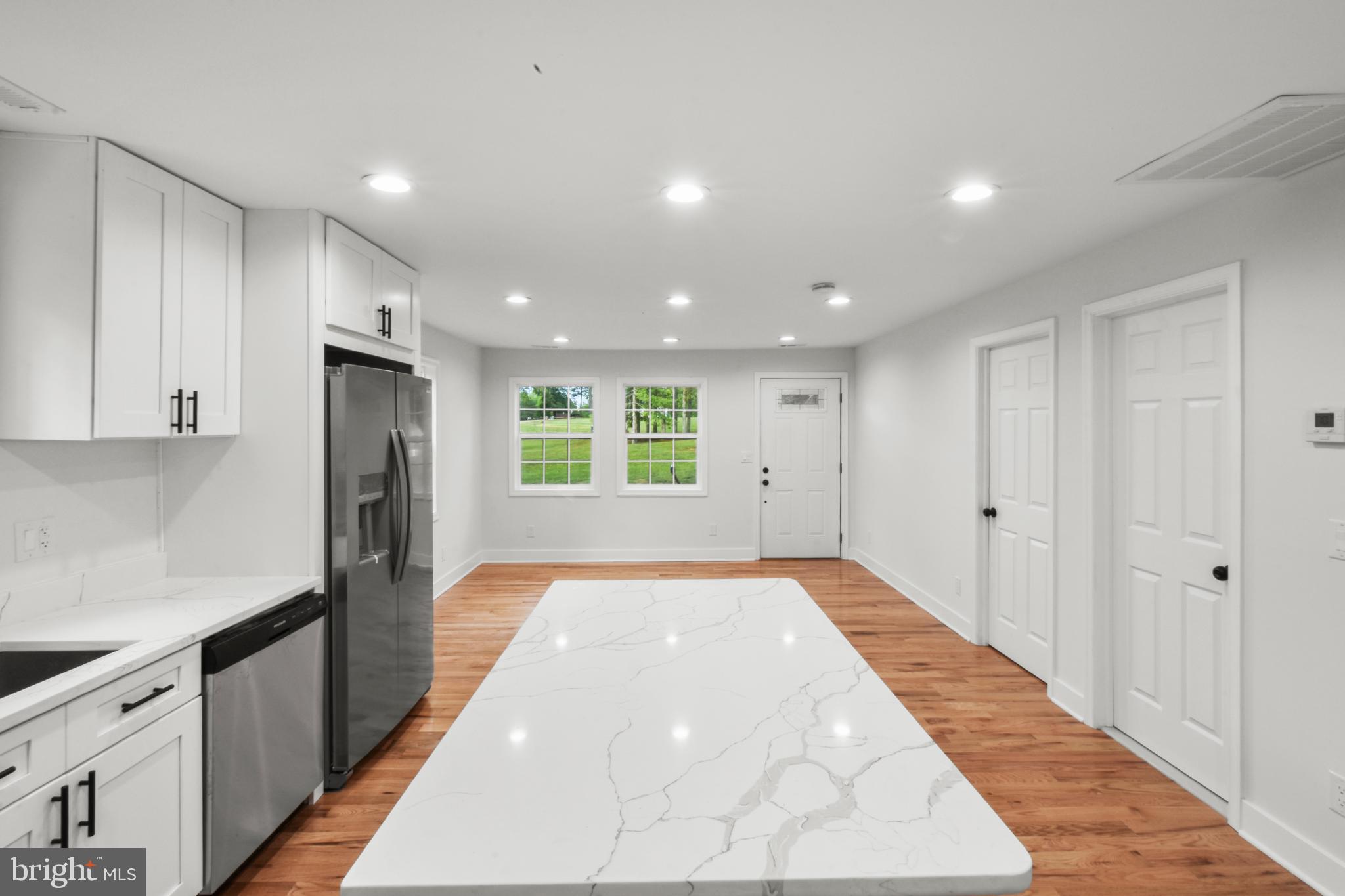 18084 Monrovia Road Orange, VA 22960 - Photo 9 of 28 a view of a kitchen with a sink and a refrigerator
