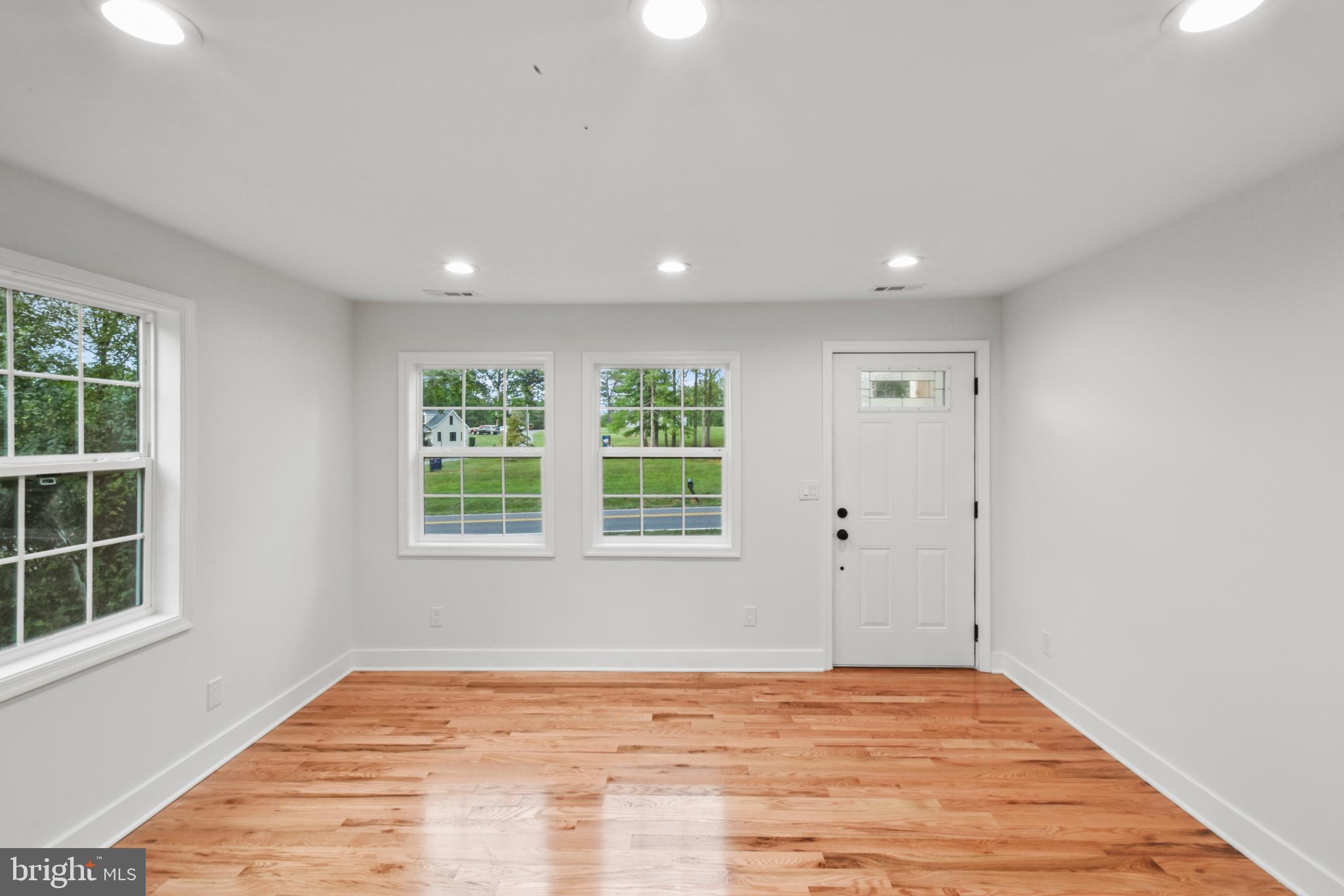 18084 Monrovia Road Orange, VA 22960 - Photo 10 of 28 a view of an empty room with wooden floor and a window